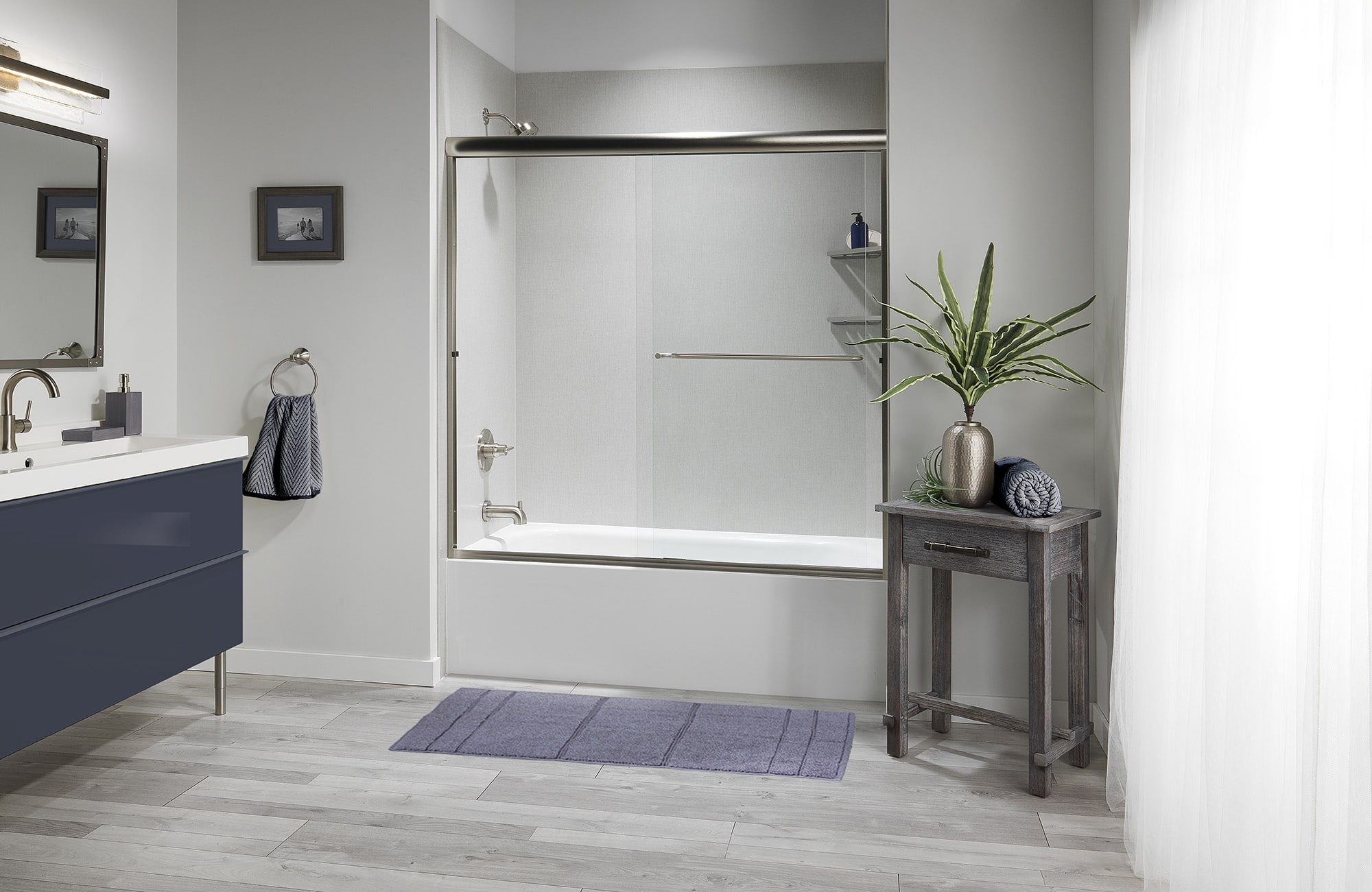 Close view of a solid surface shower surround and built-in shelving