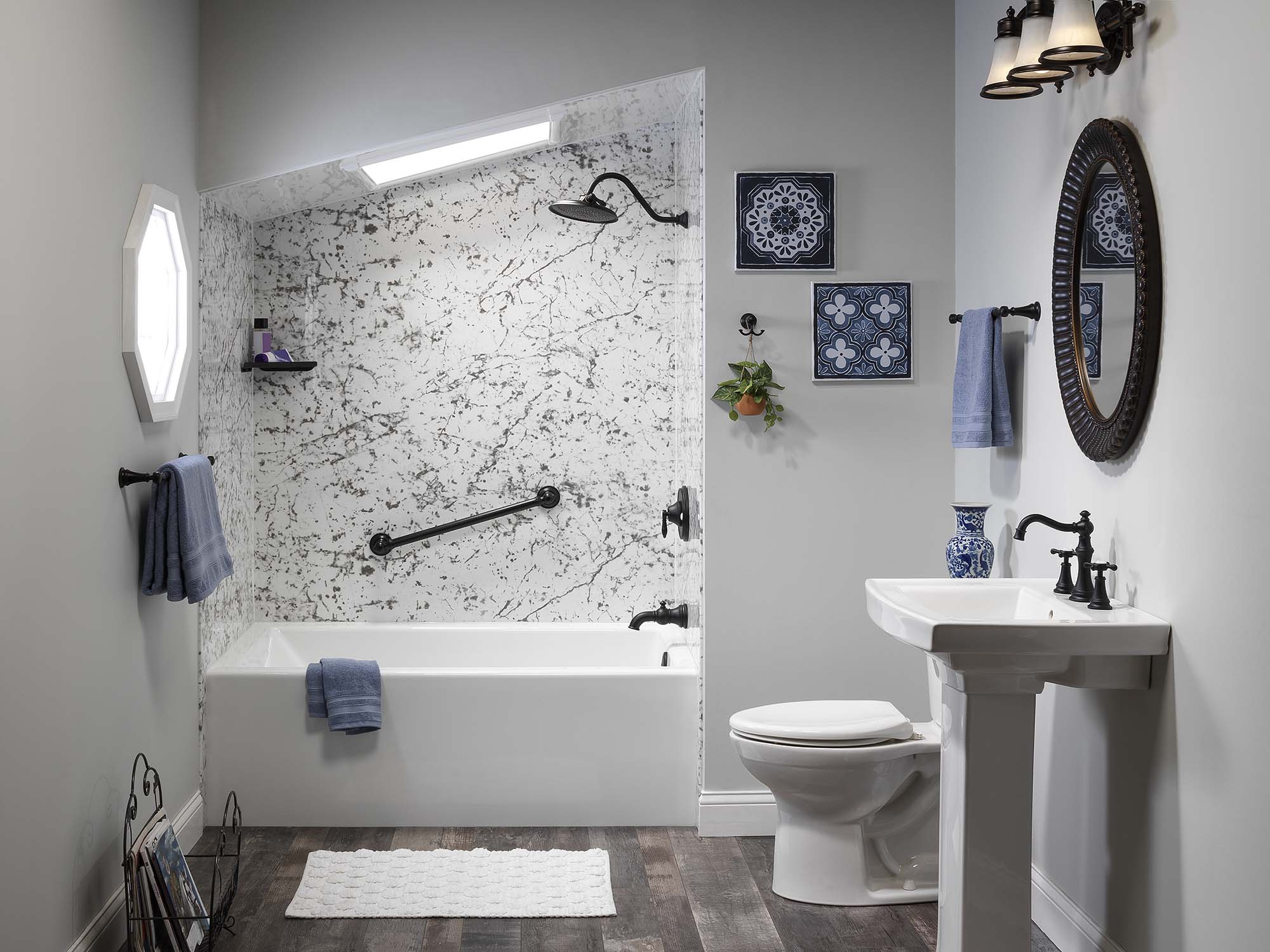 Finished shower with a solid surface surround and built-in shelving