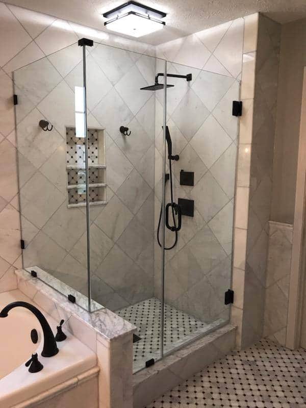 Accessible bathroom with a low-threshold shower and a grab bar
