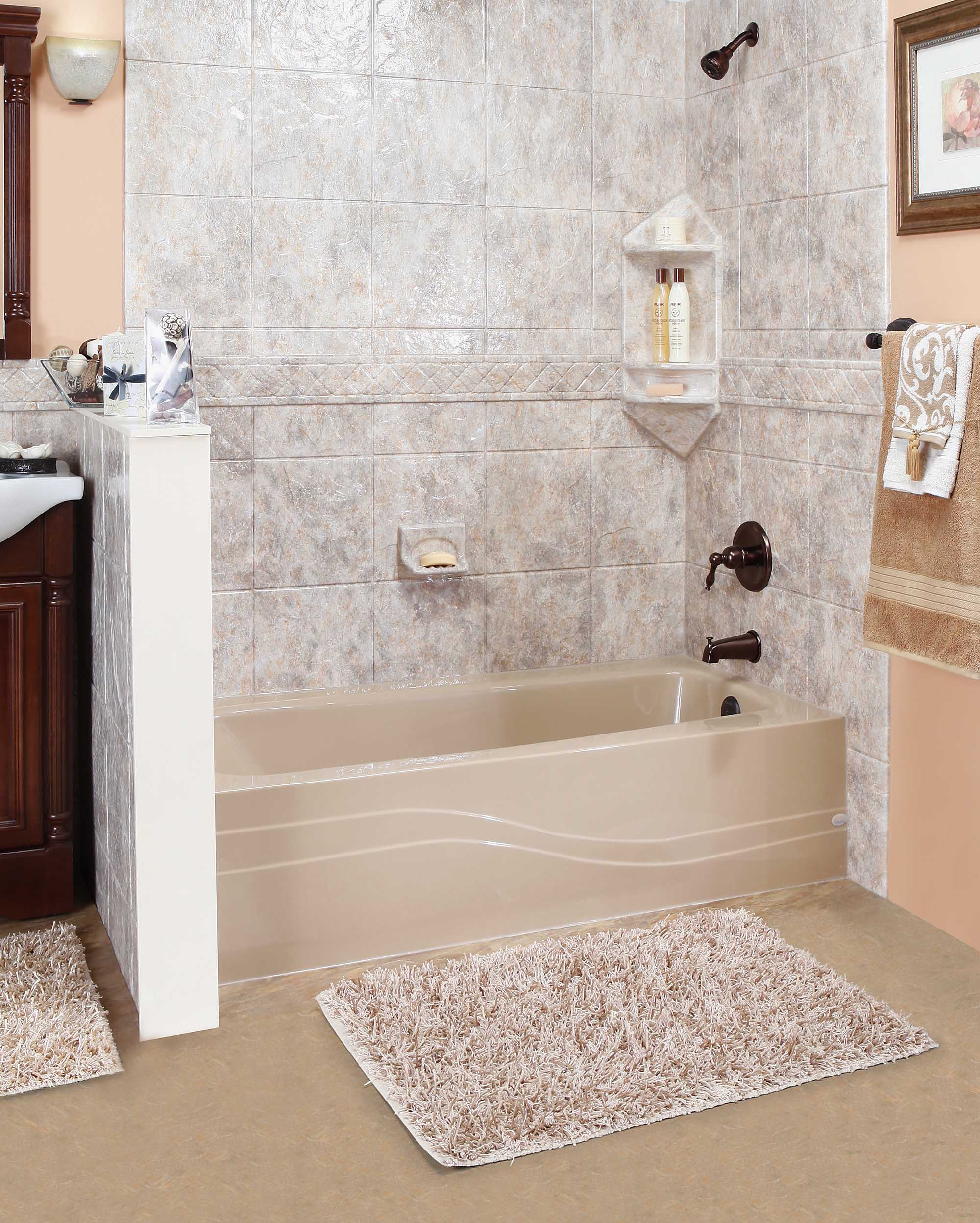 Newly fitted bathtub with a stone-pattern surround and sliding glass doors