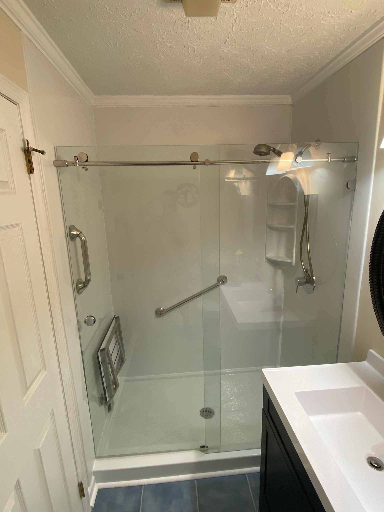 Walk-in shower fitted in the space previously occupied by a bathtub